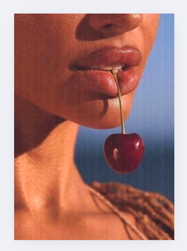 Girl holding cherry in teeth poster